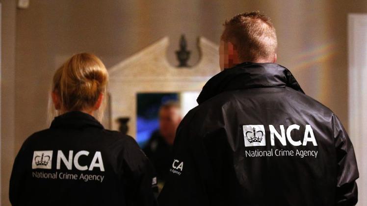 police standing with back to camera